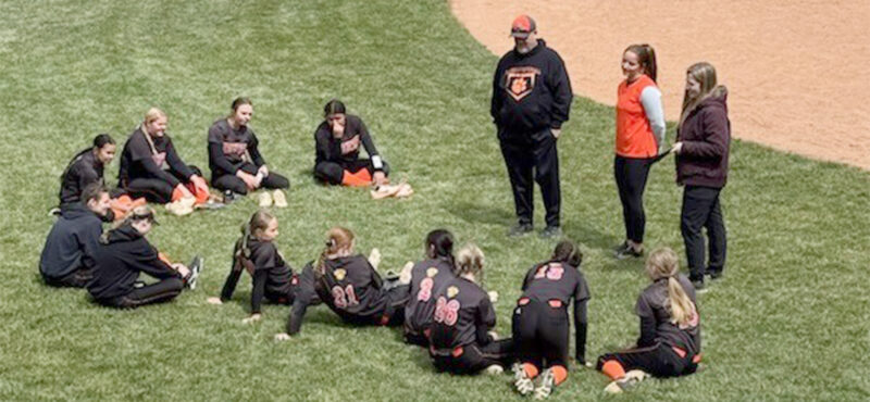 Lady Tigers split with Lady Cougars
